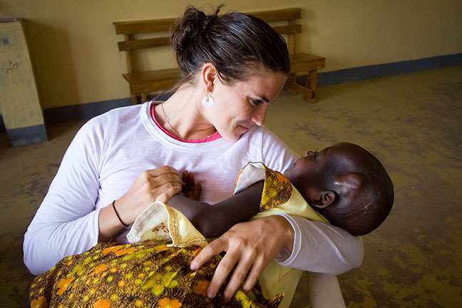Julie with a patient at CURE Uganda